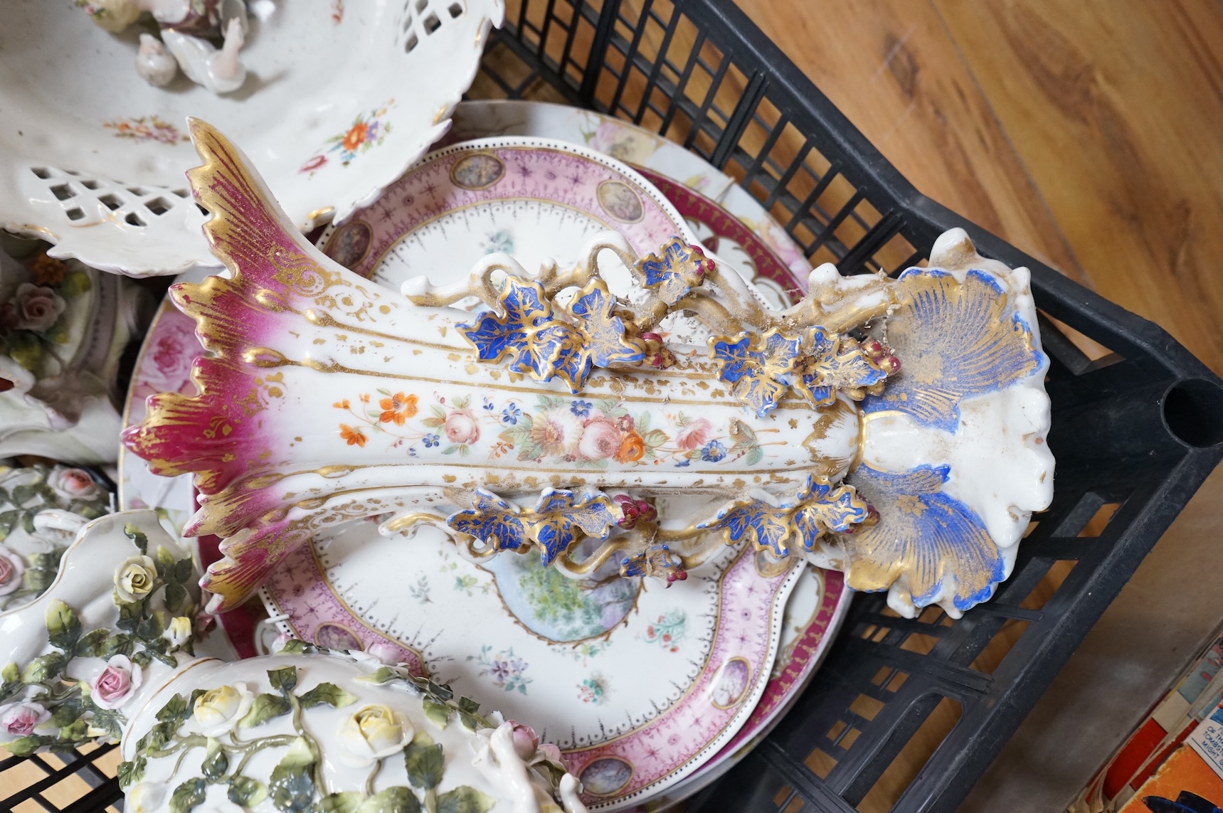 A German porcelain figural centrepiece, lobed dish, three other plates and two others
